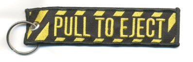 Avainperä: "PULL TO EJECT"